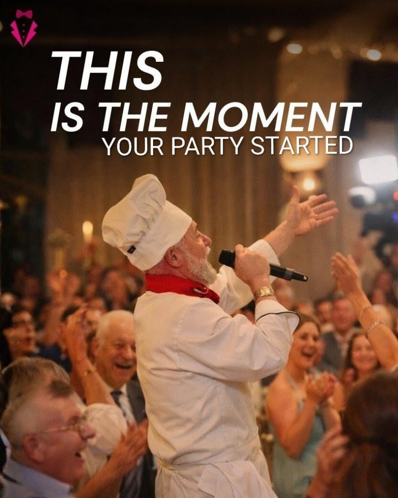 Singing Chef in chef’s hat and whites holding a microphone, surrounded by cheering guests at a lively indoor party.